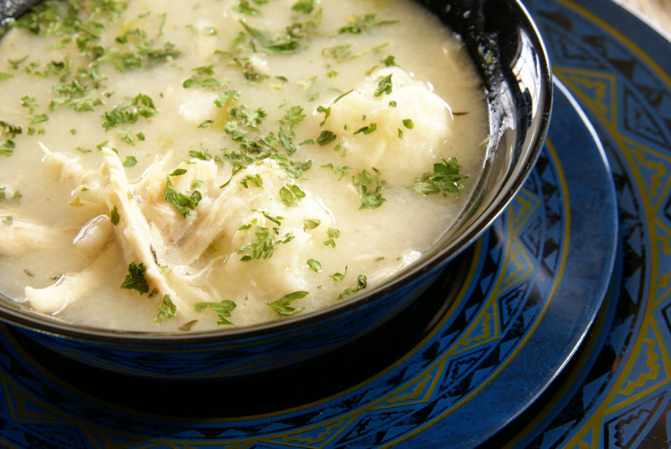 Old fashioned southern style chicken or turkey and dumplings with parsley sprinkled on top.