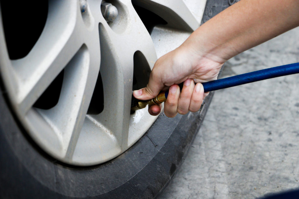 inflating tire and checking air pressure