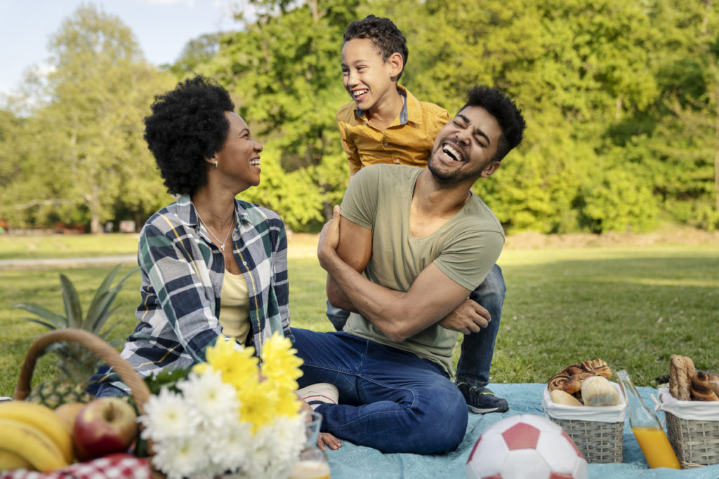 Happy family spending a sunny day on a picnic