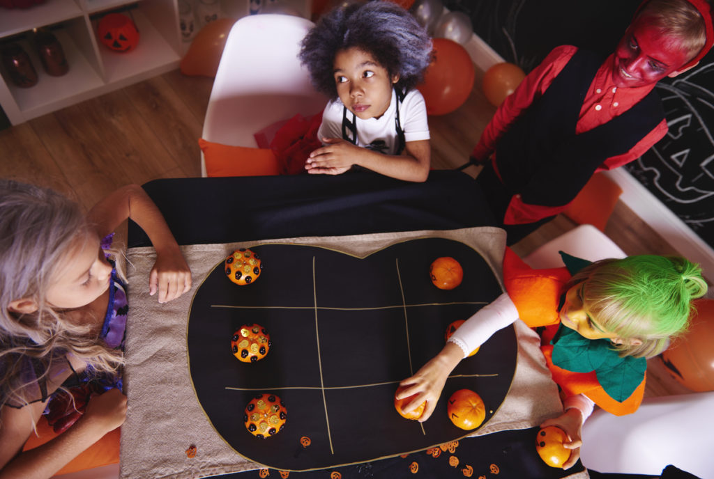 Kids spending time together while playing Halloween party game