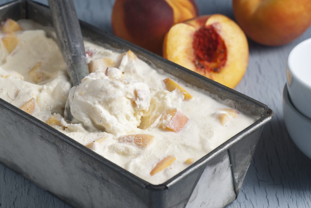 A pan of homemade peach ice cream