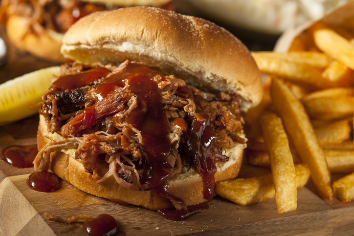 Barbeque Pulled Pork Sandwich with BBQ Sauce and Fries